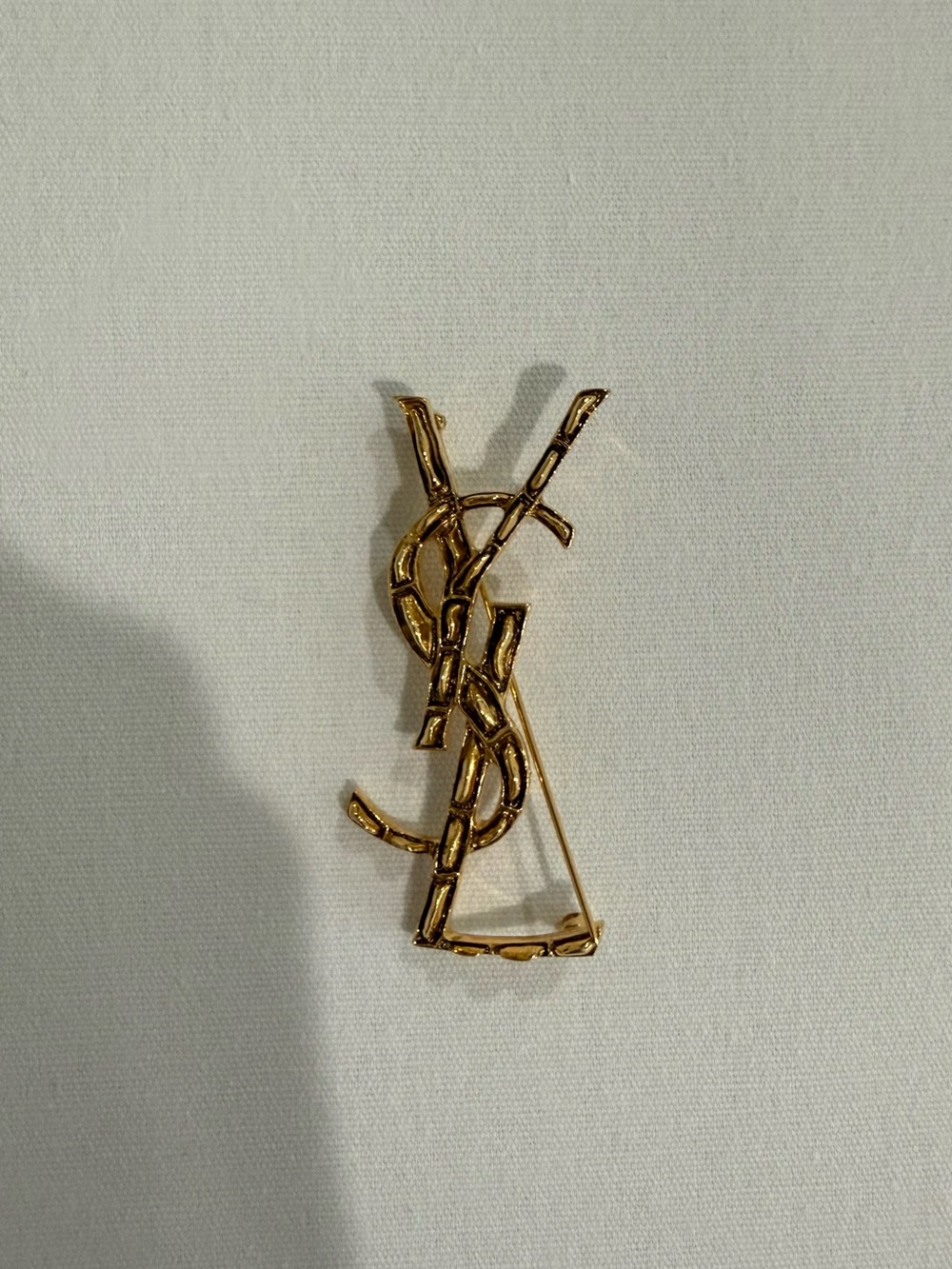 Saint Laurent Goldtone Textured Logo Brooch